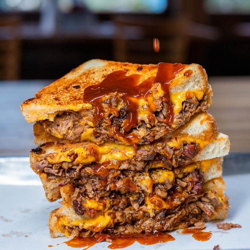 Smoke shack BBQ signature dishes Brisket, Pulled Pork, Chopped Brisket Sandwich.